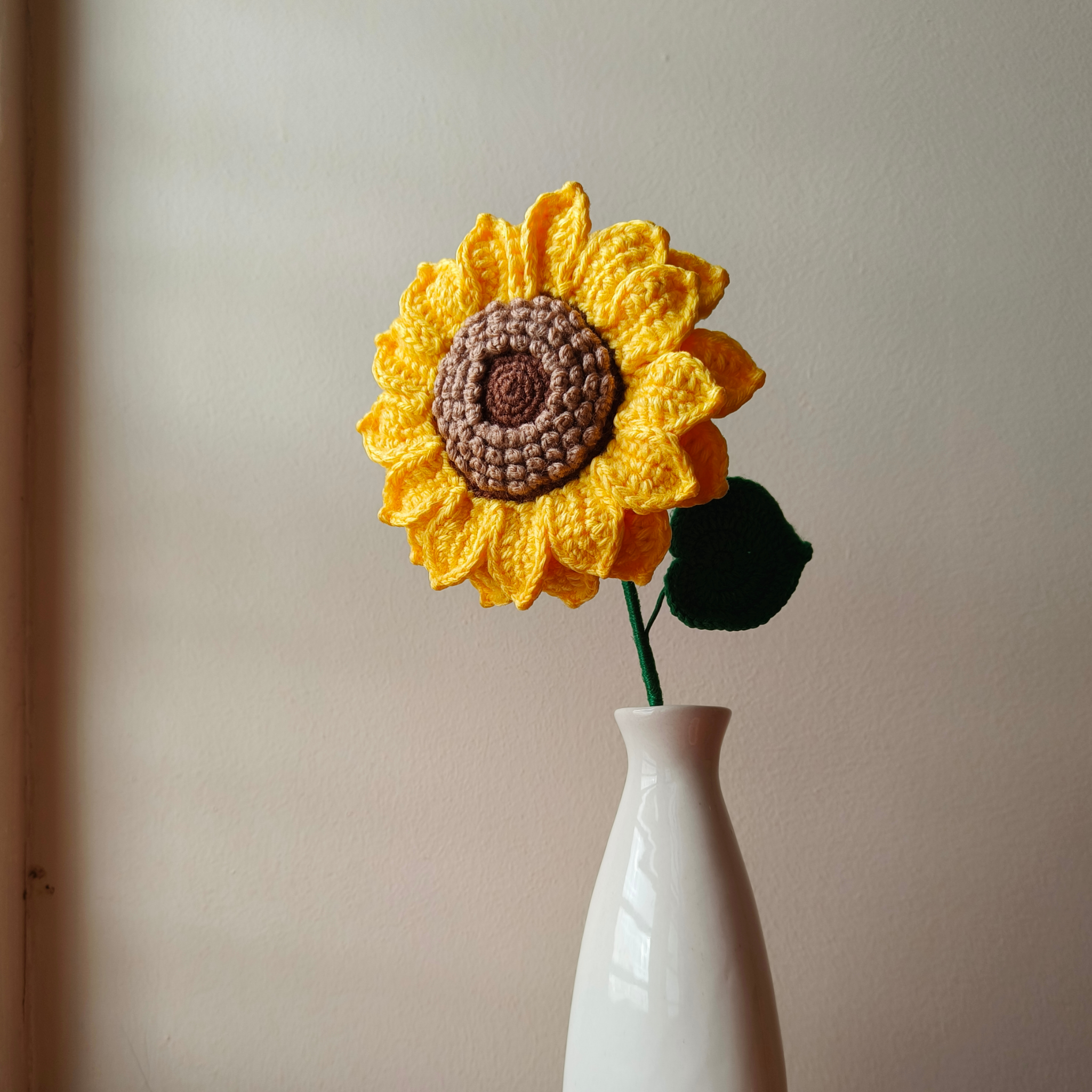A beautiful large sized crochet sunflower in a vase made of premium acrylic yarn and great finishing.